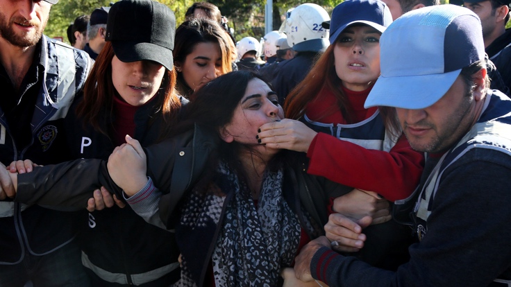 Police detain DBP co-chair Tuncel during a protest against the arrest of Kurdish lawmakers, in Diyarbakir
